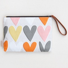 Heart Print Clutch Bag by Caroline Gardner